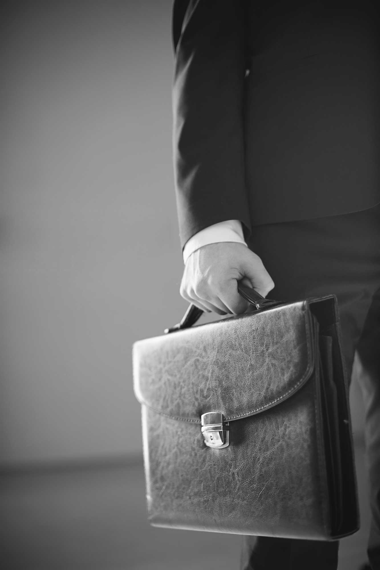 close-up-of-businessman-holding-a-briefcase